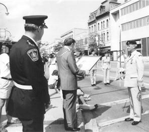 Freedom of the City Proclamation re-enacted on the occasion of the Regiment's 125th Anniversary. Guelph Mayor J. Counsell presented Lieutenant-Colonel R.G. French the original proclamation under the watchful eye of Police Chief D. Stewart in summer of 1991.
